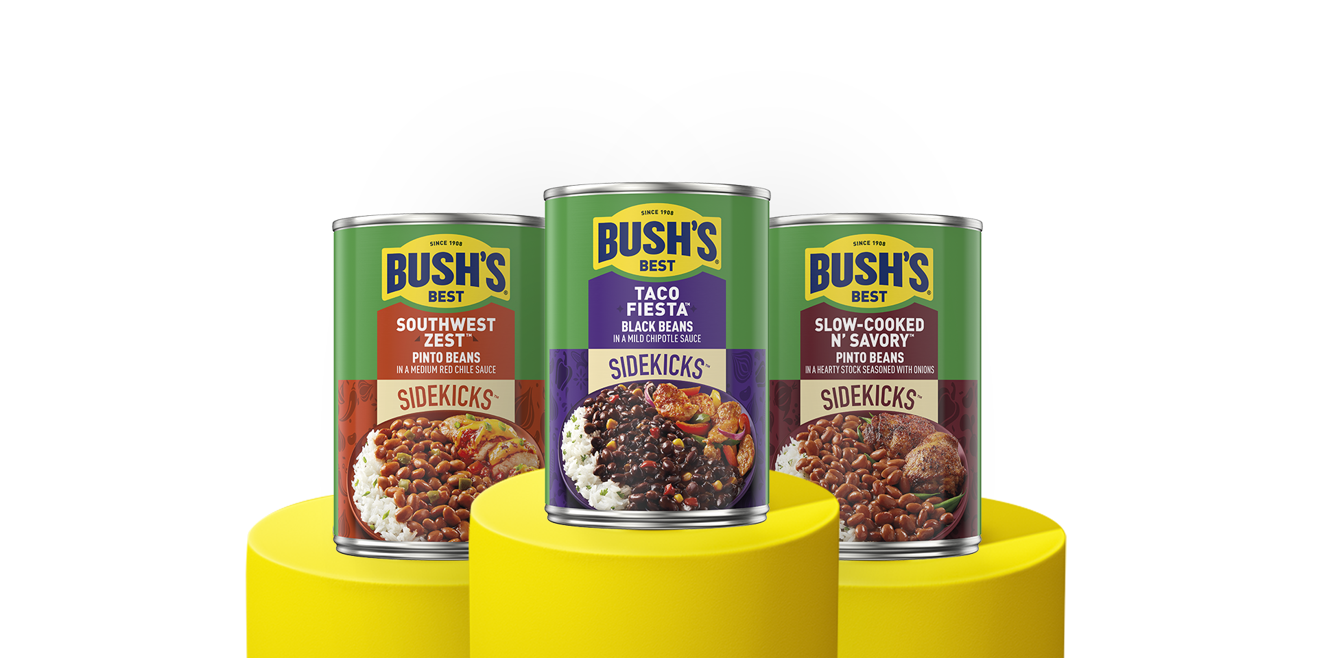 three cans of Bush's Sidekicks beans on a yellow pedestals.