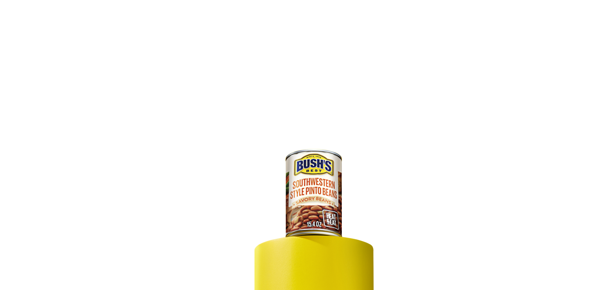 A can of Bush’s Best Savory Beans Southwestern Style Pinto beans sitting on a yellow column
